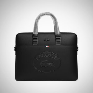 Lacoste bag with crocodile logo, clear plastic handles, and a small Lacoste logo on the front. Designed for stylish and functional travel.