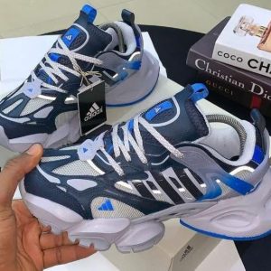 Sneakers, loafers, and other types of shoes in various colors and styles, available for purchase on the website.